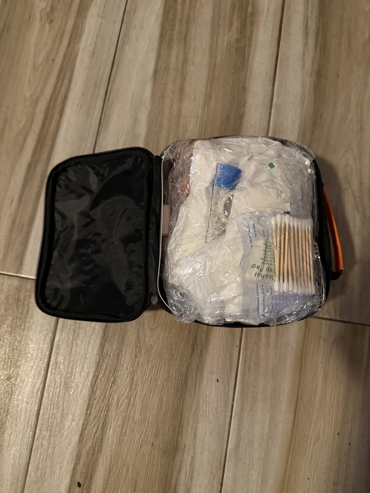 Kai's Run first-aid kit open, packed with wound-care supplies